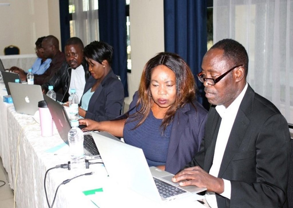 group of participants working with laptop computers